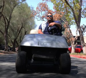 Associate Dean of Students Mr. Kai Bell patrols the parking lot.