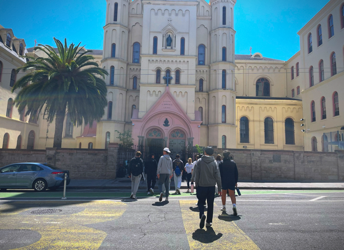 Juniors walk into St. Andrew's Church in San Francisco during their Urban Plunge