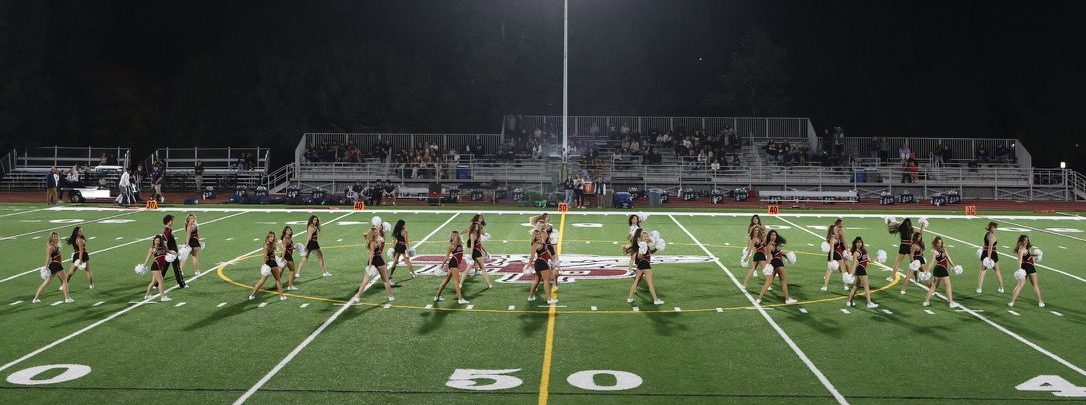 Pulse dance team performs during halftime at Friday Night Lights football game.
