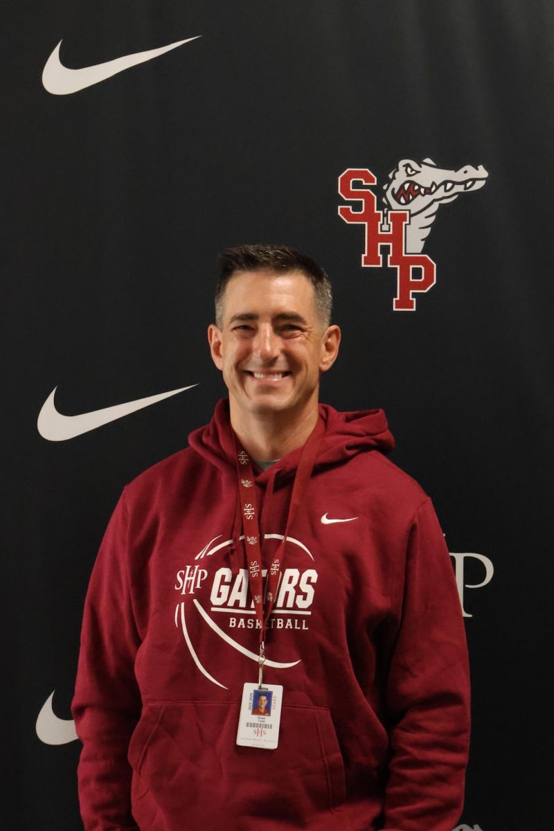 Coach Chad Tyler poses in the Athletics Offices.