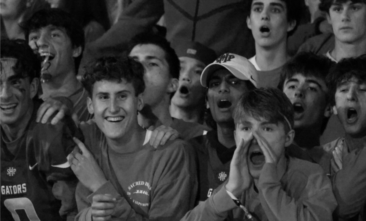 Student section cheers for Varsity Boys football at Valpo Bowl.
