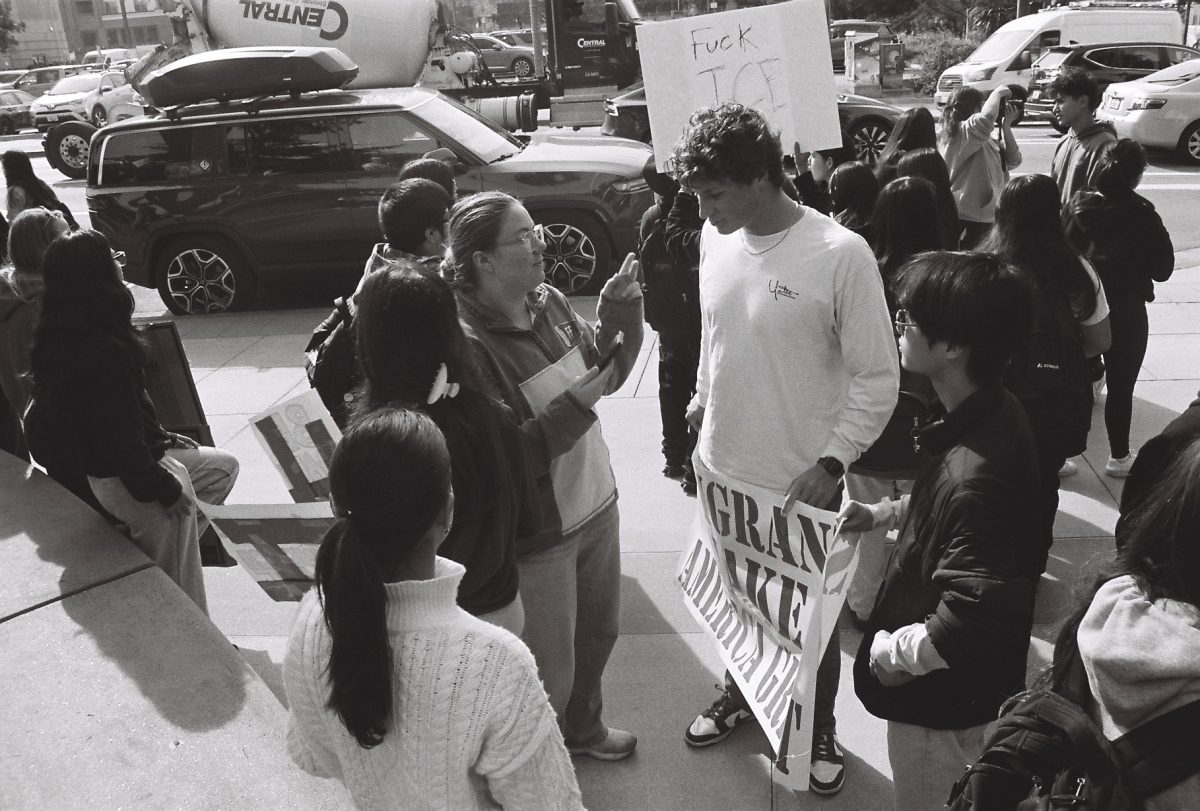 Brooke Soderbery '26 interviewing David Edelman '26 at a Redwood City protest.